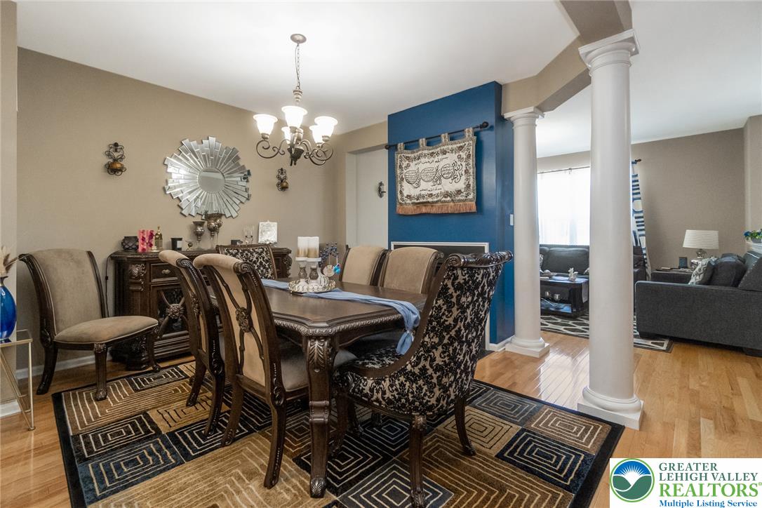 3566 Penfield Way Nazareth, PA 18064 - Photo 18 of 47 Hardwood floors and decorative pillars define this formal dining space, offering elegant transitions to adjacent living areas.