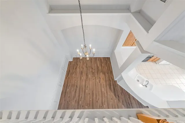 a view of a hallway view with wooden floor and staircase