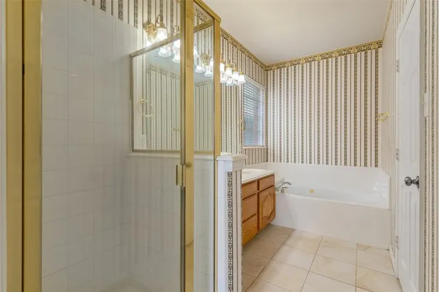 a bathroom with a bathtub and shower