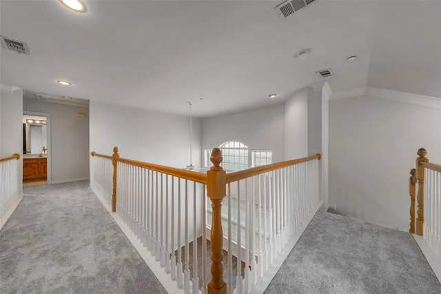 a view of a hallway with a livingroom