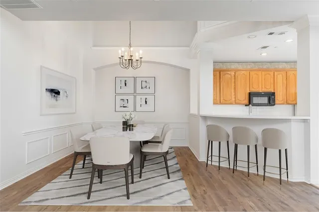 a view of a dining room with furniture and window
