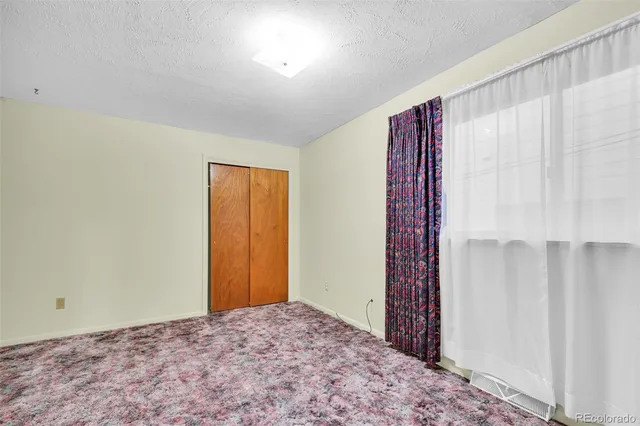 a view of a room with window and a projector