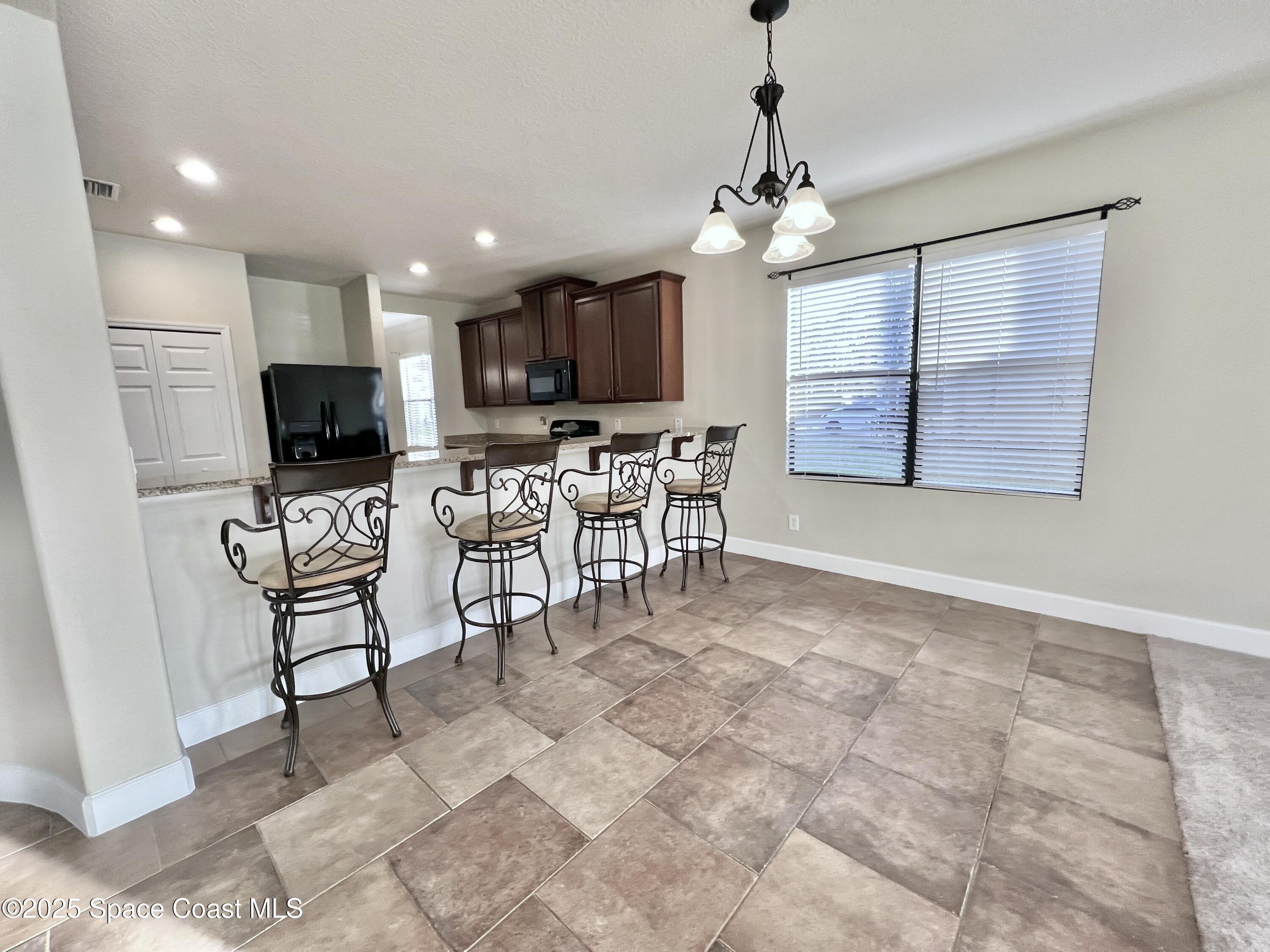 909 Whetstone Place Rockledge, FL 32955 - Photo 14 of 23 Large Dining Nook