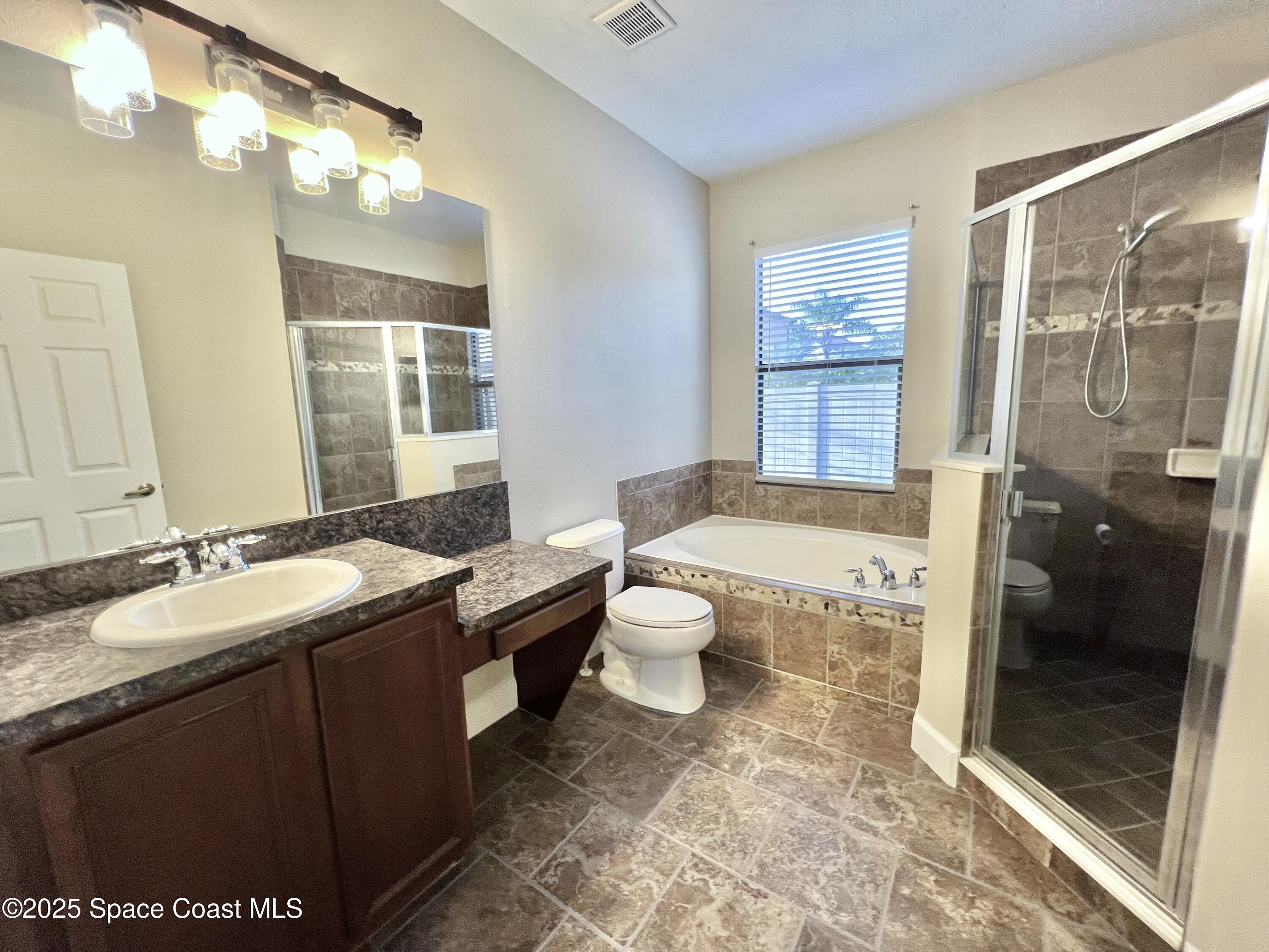 909 Whetstone Place Rockledge, FL 32955 - Photo 18 of 23 Primary Bathroom