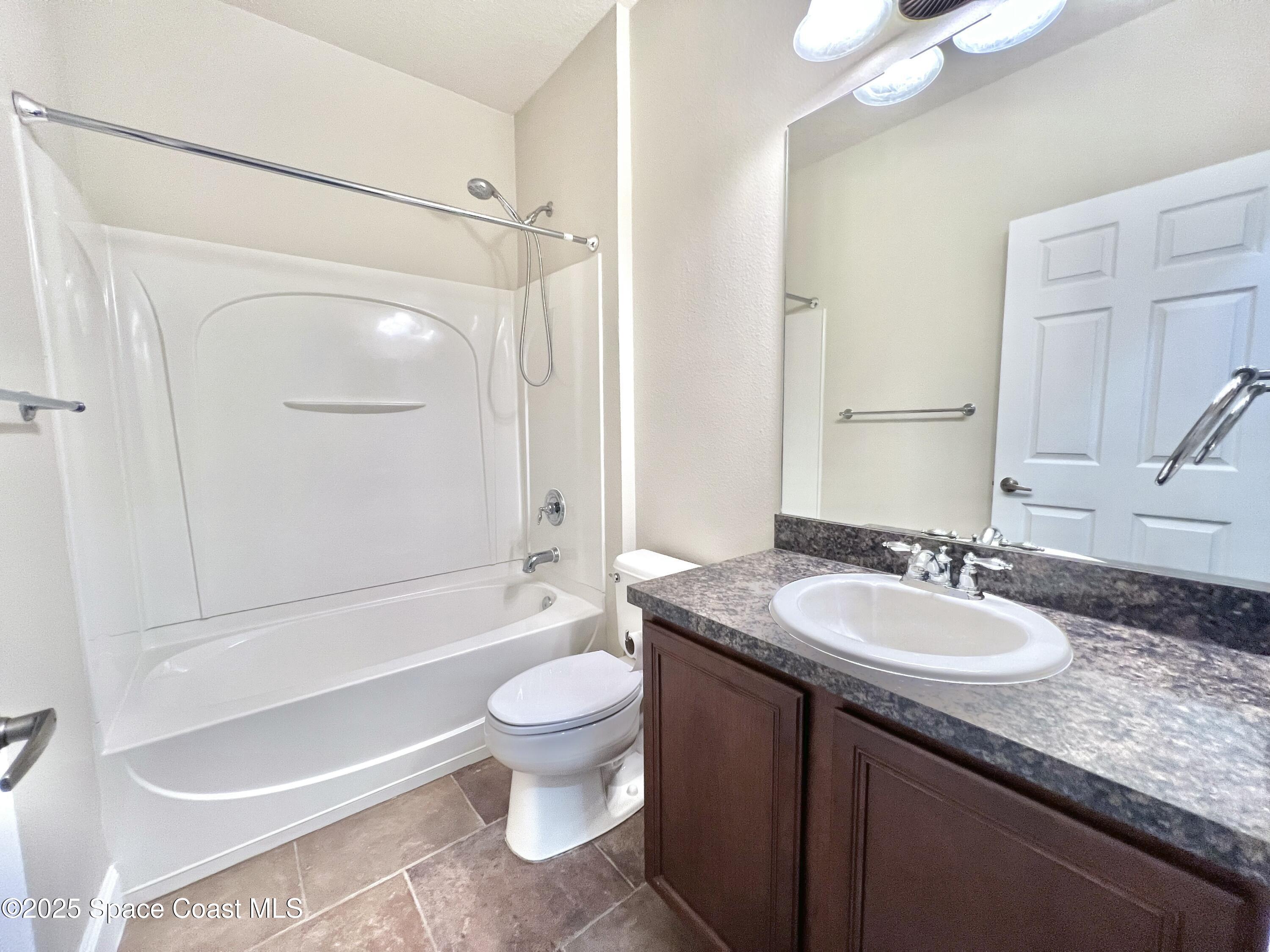 909 Whetstone Place Rockledge, FL 32955 - Photo 21 of 23 Hall Bathroom