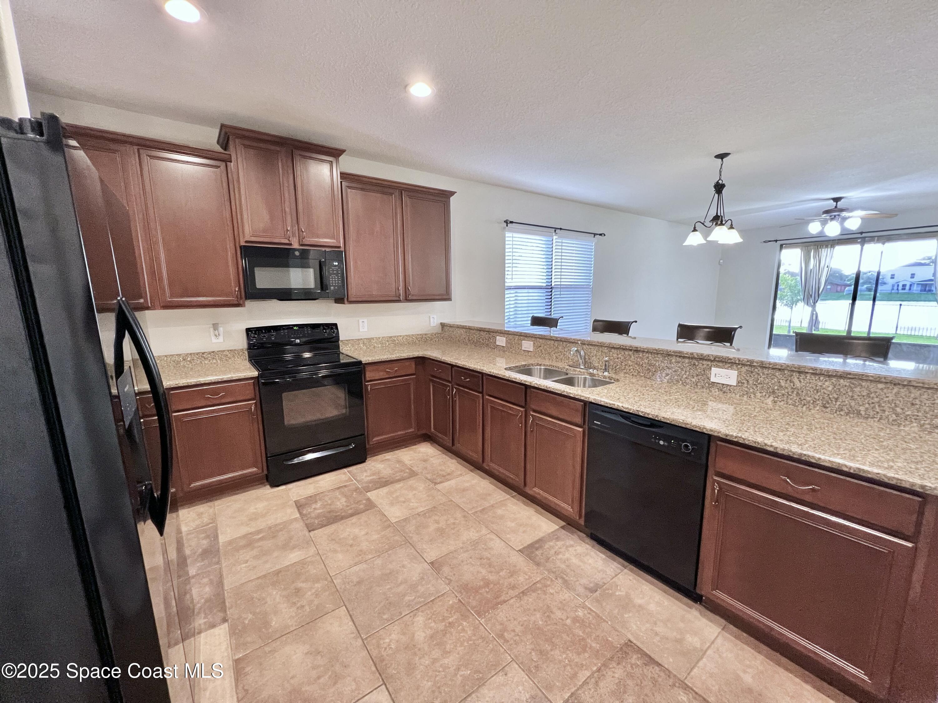 909 Whetstone Place Rockledge, FL 32955 - Photo 9 of 23 Kitchen