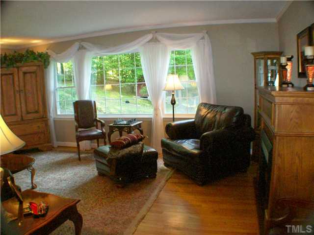 8805 Red Oak Court Raleigh, NC 27613 - Photo 2 of 12 Gleaming hardwood floors..picture window w view..crown molding..room to roam. Now this is Living!