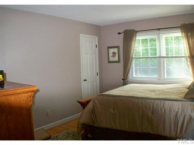 8805 Red Oak Court Raleigh, NC 27613 - Photo 9 of 12 Another nice space with hardwood floors. This bedroom has two closets, and a great view. Those windows are the new vinyl tilt energy efficient ones you will find throuhout this home.