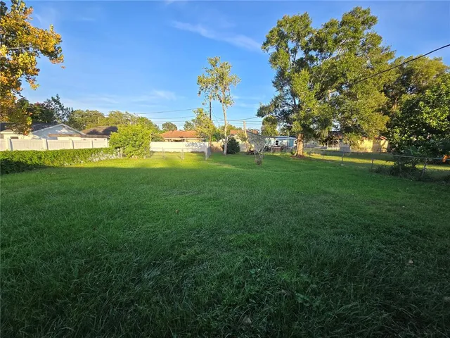 a view of a large green field with lots of green space