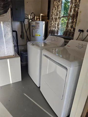 a view of storage and utility room with washer and dryer