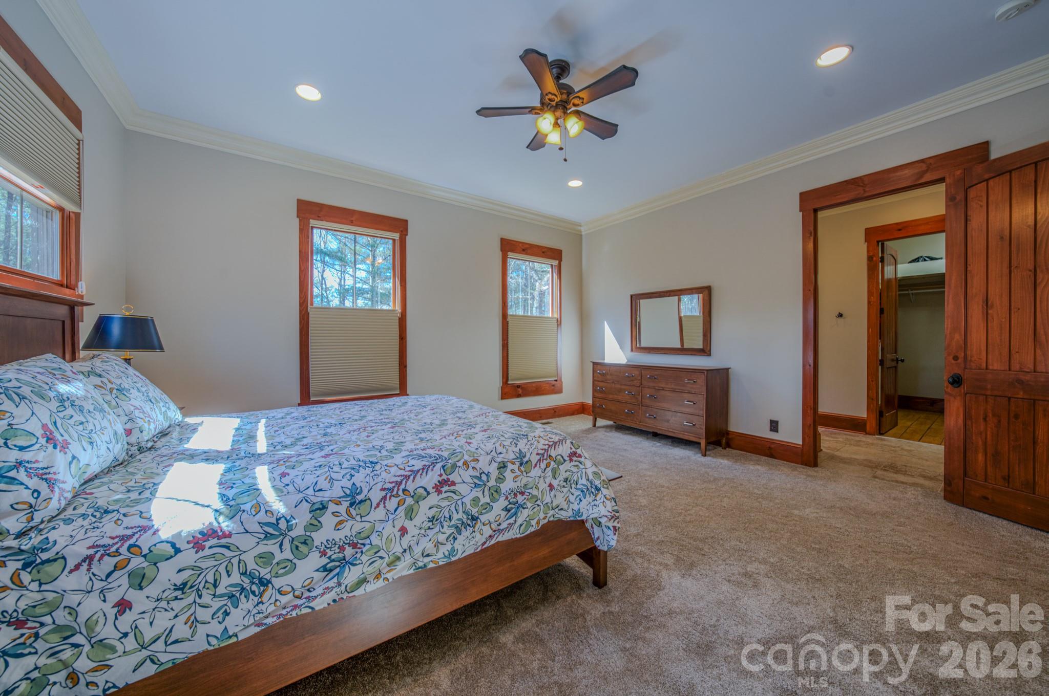 4836 Stream Side Lane, Unit 18 Morganton, NC 28655 - Photo 12 of 46 a bedroom with a bed and a chandelier