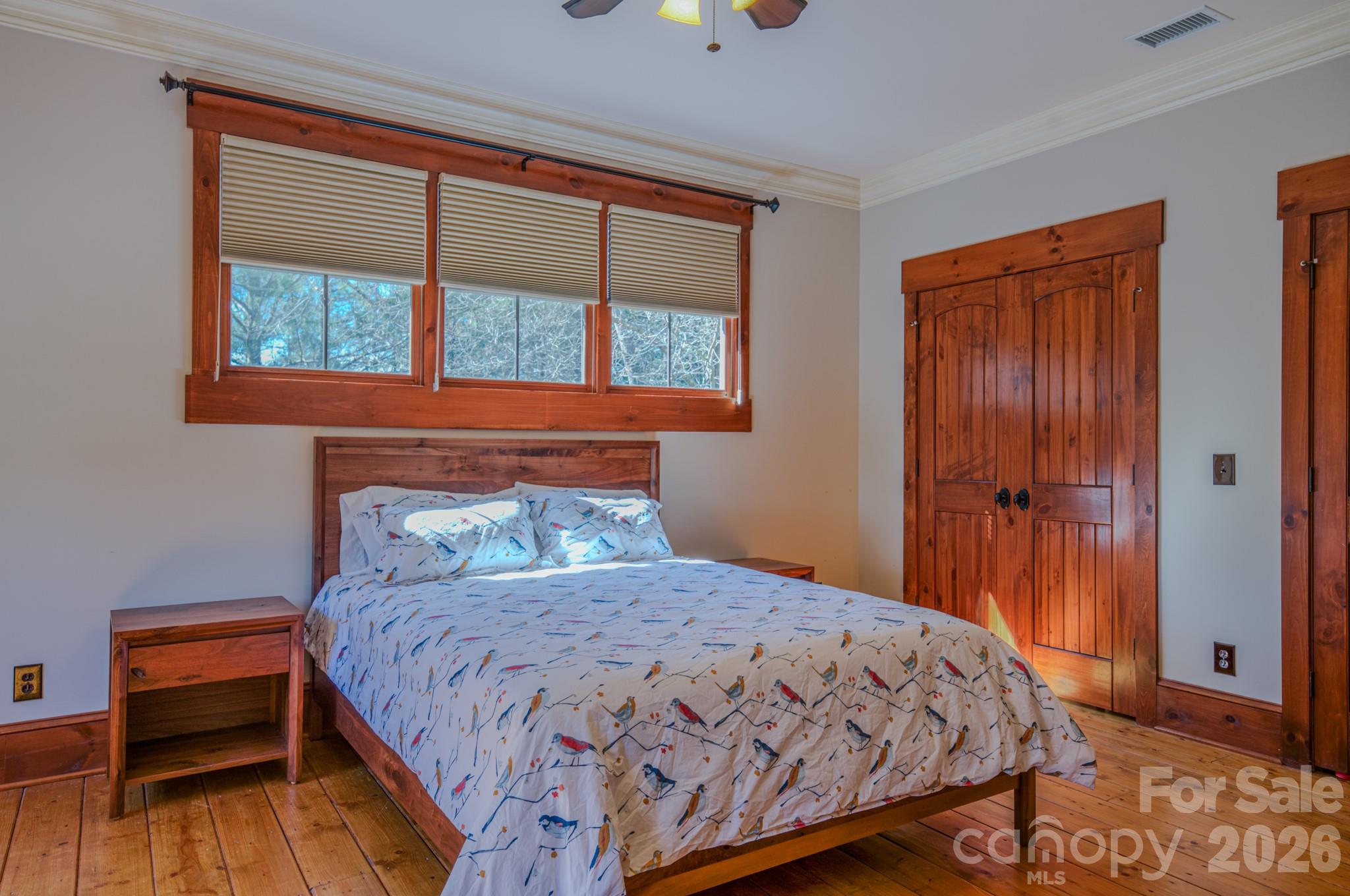 4836 Stream Side Lane, Unit 18 Morganton, NC 28655 - Photo 13 of 46 a bedroom with a bed a dresser and a window
