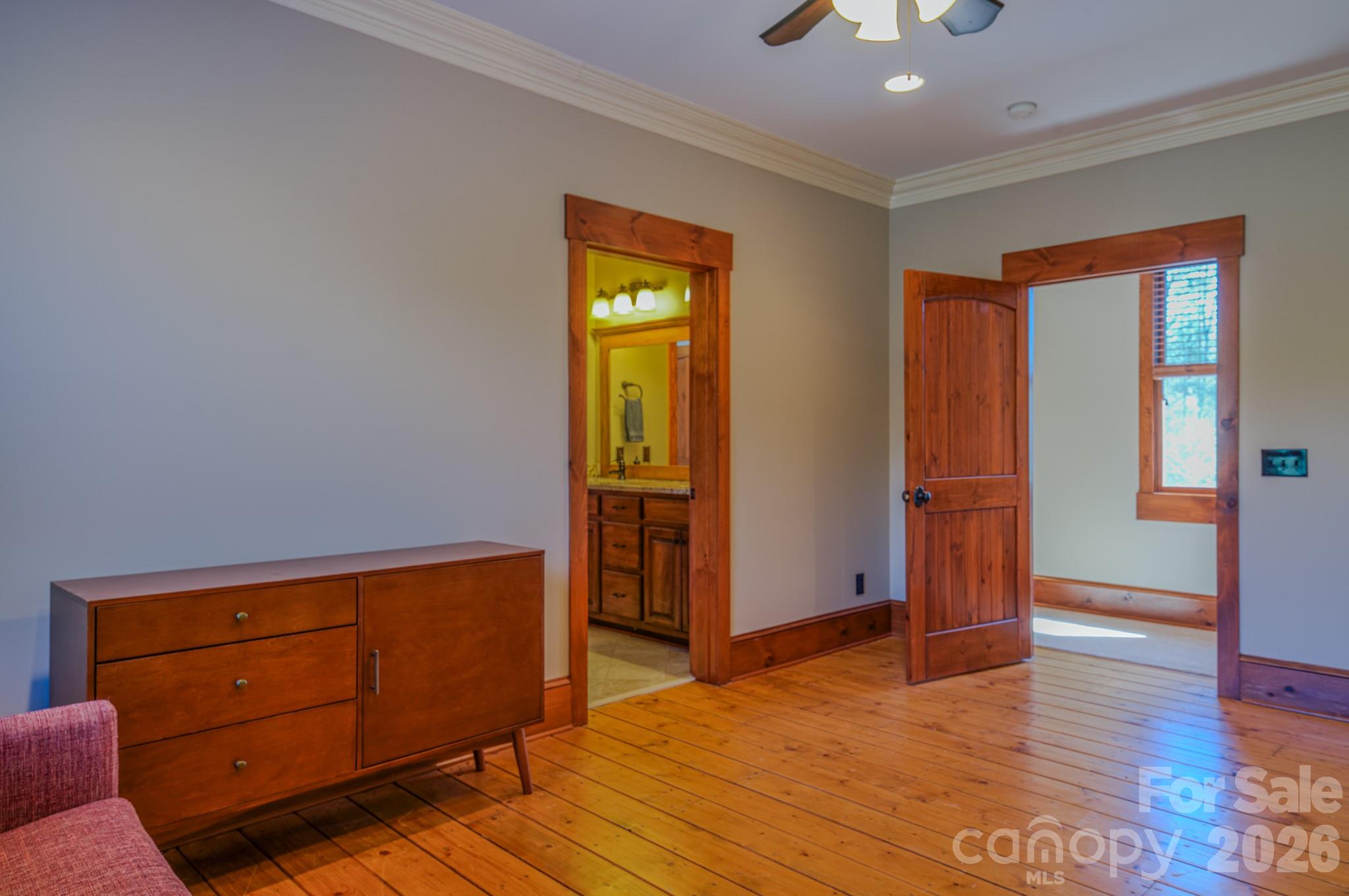 4836 Stream Side Lane, Unit 18 Morganton, NC 28655 - Photo 18 of 46 a view of an empty room with wooden floor and a window
