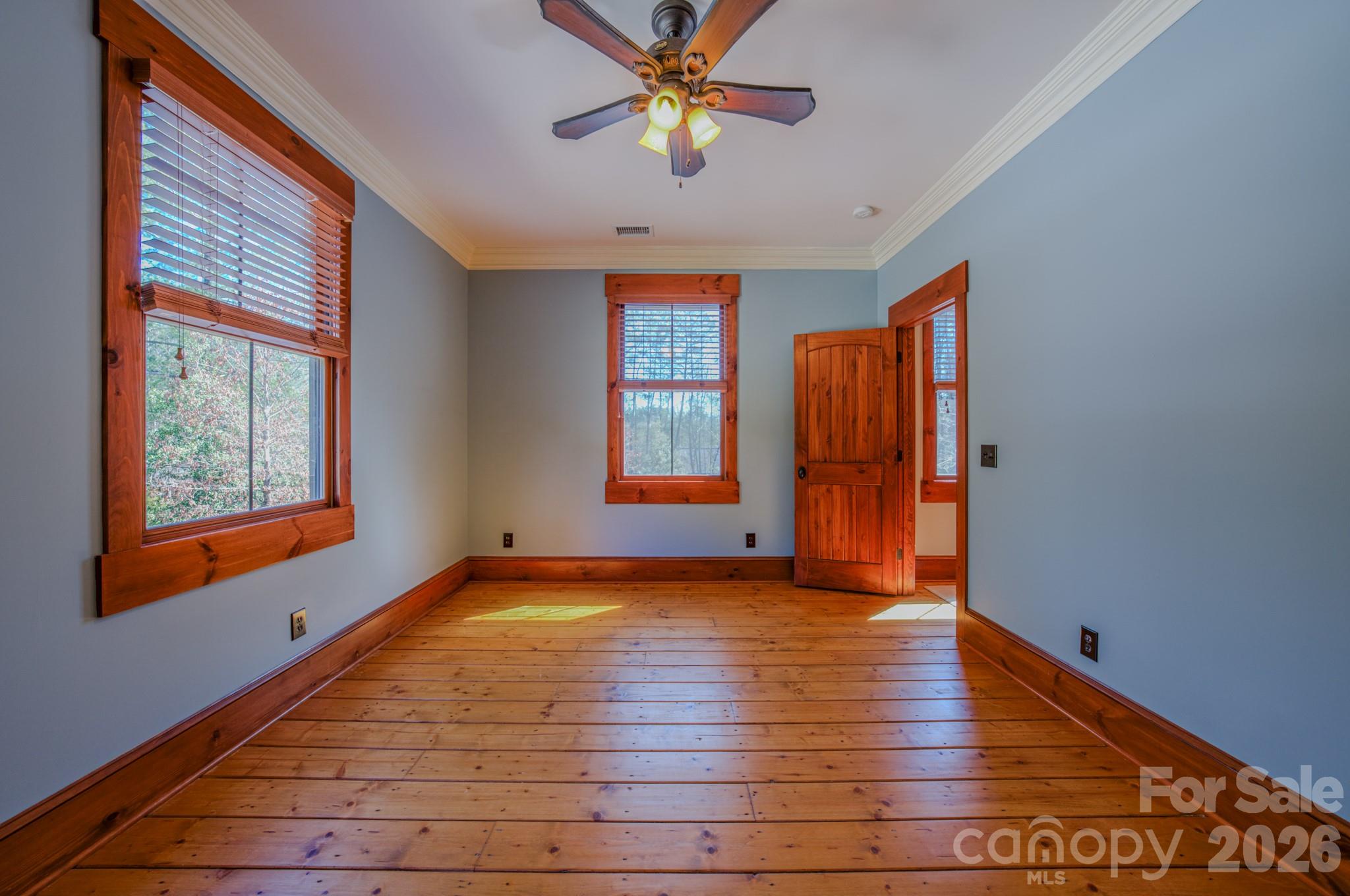 4836 Stream Side Lane, Unit 18 Morganton, NC 28655 - Photo 25 of 46 a view of an empty room with window and wooden floor