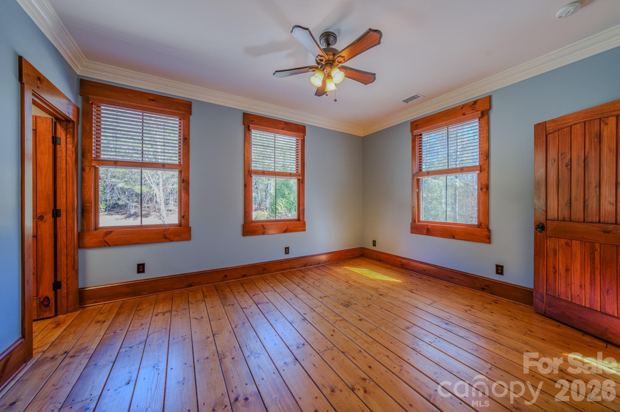 4836 Stream Side Lane, Unit 18 Morganton, NC 28655 - Photo 26 of 46 an empty room with wooden floor and windows