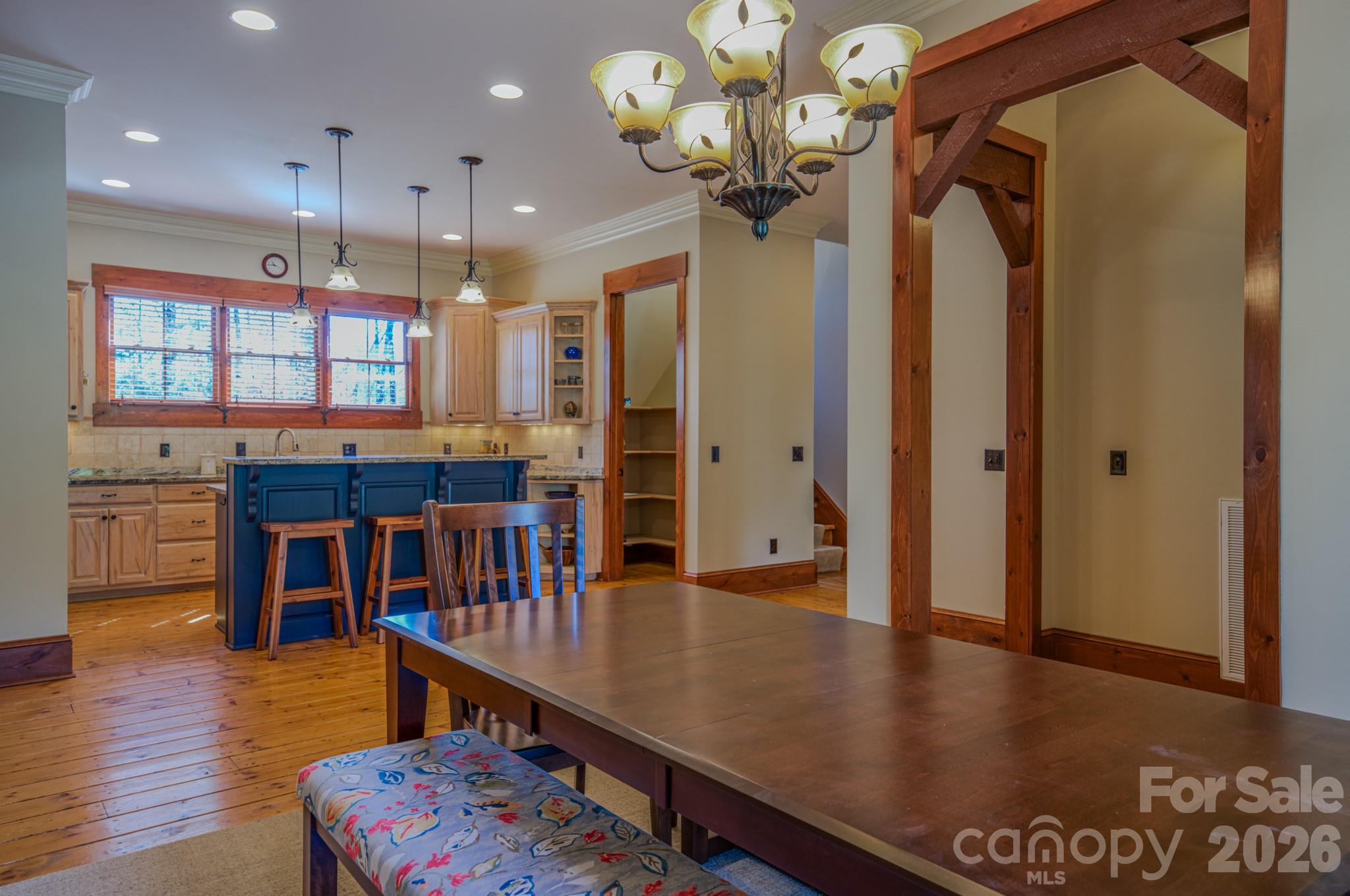 4836 Stream Side Lane, Unit 18 Morganton, NC 28655 - Photo 40 of 46 a kitchen with stainless steel appliances granite countertop a refrigerator a sink and a stove