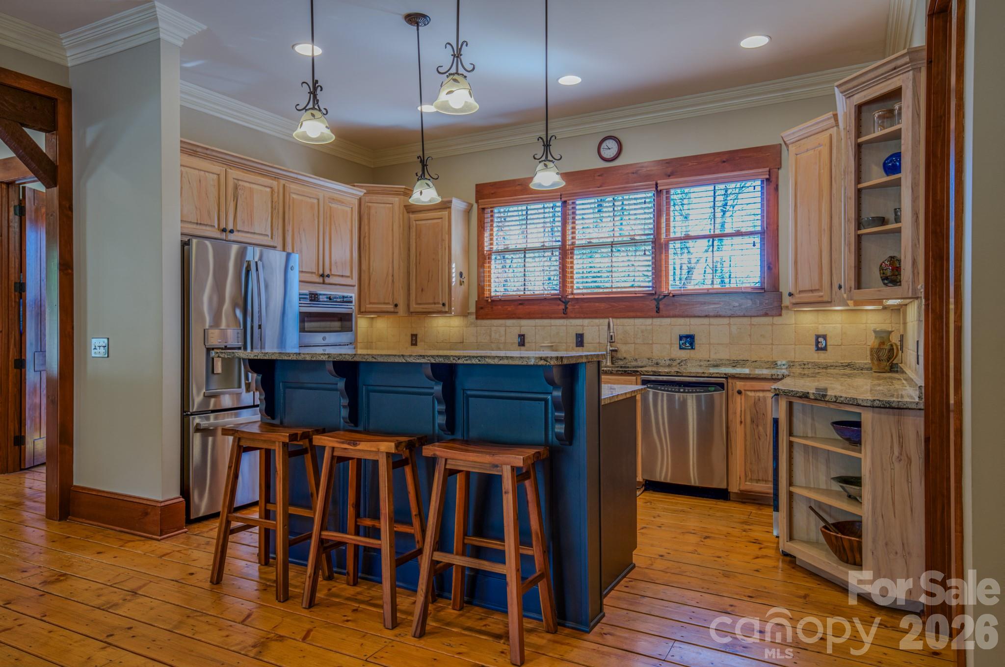 4836 Stream Side Lane, Unit 18 Morganton, NC 28655 - Photo 42 of 46 a kitchen with stainless steel appliances granite countertop a stove and a refrigerator