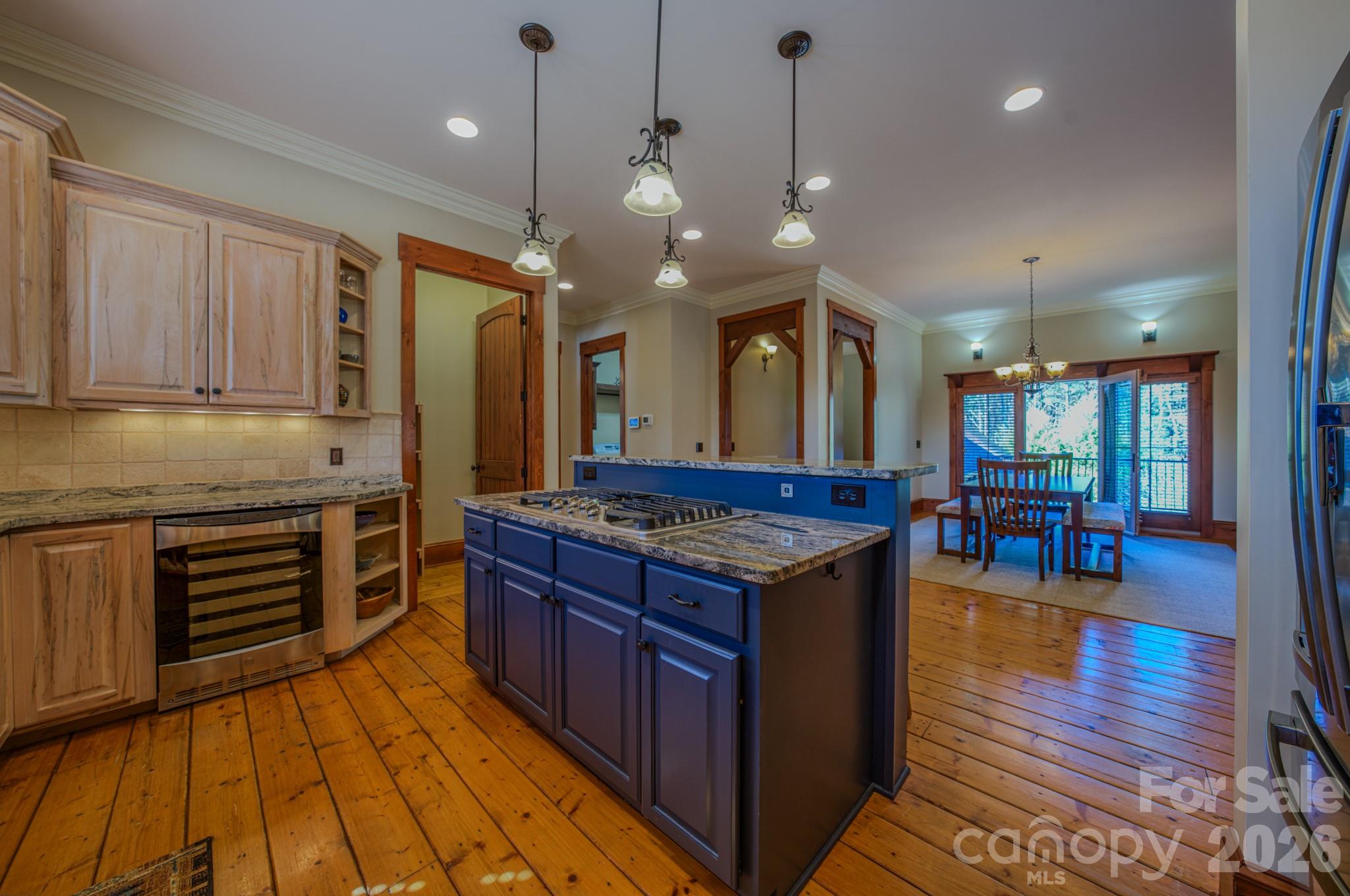 4836 Stream Side Lane, Unit 18 Morganton, NC 28655 - Photo 10 of 46 a kitchen with stainless steel appliances granite countertop wooden cabinets a stove a sink and a large window
