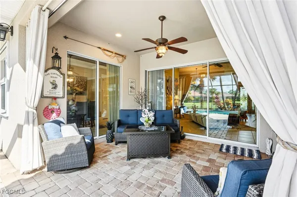 a view of a swimming pool with a patio and a porch