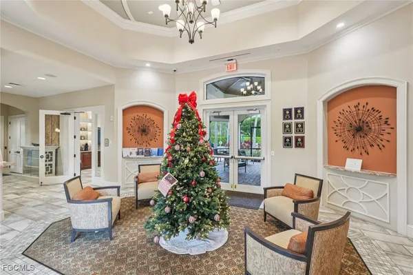 a store room filled with furniture and a chandelier