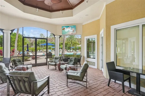 a view of a park with a big yard and palm trees