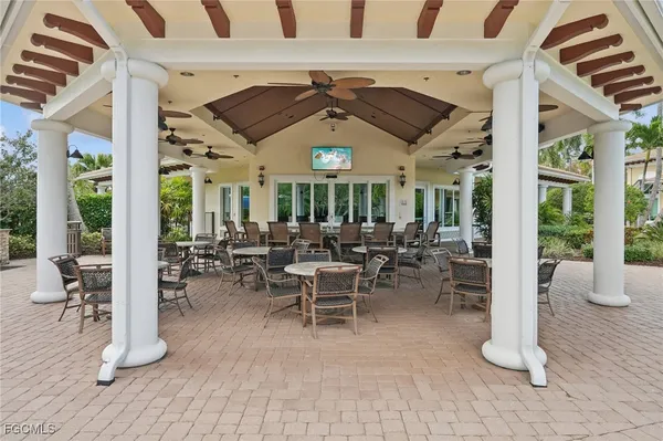 a view of a patio with couches and potted plants