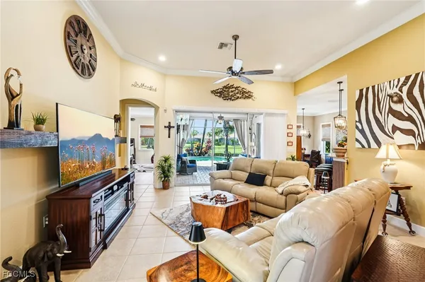 a living room with furniture and a flat screen tv