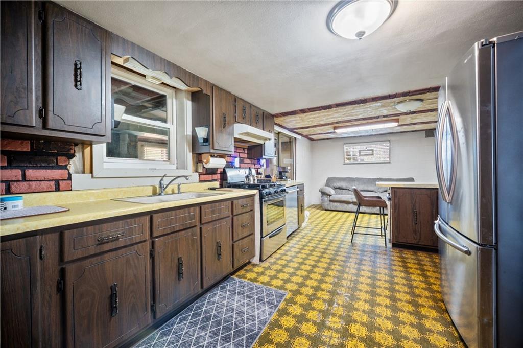 415 North Avenue Houston, PA 15342 - Photo 15 of 27 a kitchen with a sink appliances and cabinets