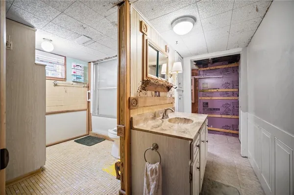 a bathroom with a shower and a toilet
