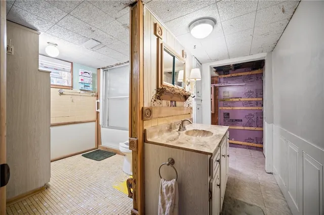 a bathroom with a shower and a toilet