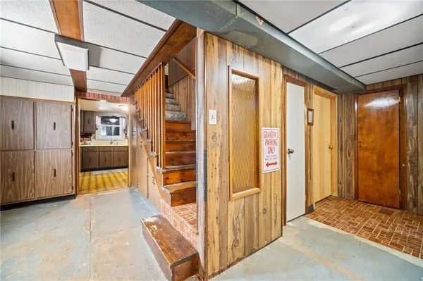 a kitchen with refrigerator and cabinets