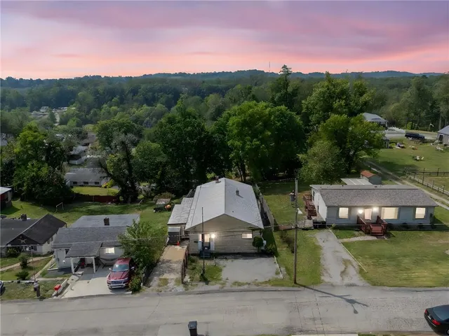 an aerial view of a house with a garden