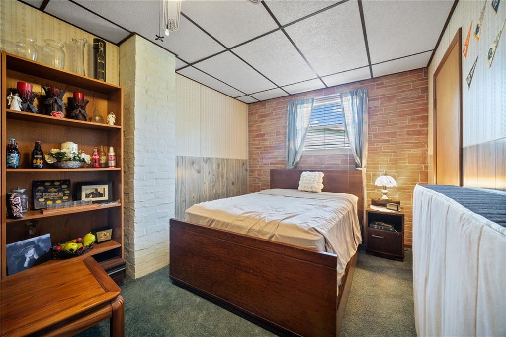 415 North Avenue Houston, PA 15342 - Photo 5 of 27 a bed sitting in a bedroom next to a window