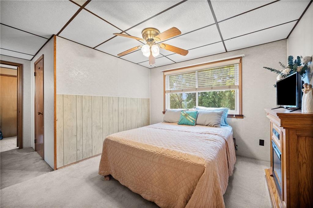 415 North Avenue Houston, PA 15342 - Photo 7 of 27 a bedroom with a bed and a flat screen tv