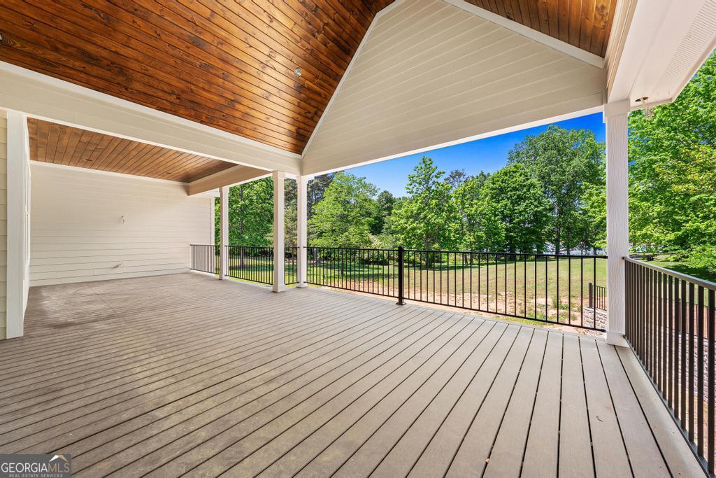 707 Vickery Street Extension Hartwell, GA 30643 - Photo 15 of 36 a view of backyard with a deck and wooden floor