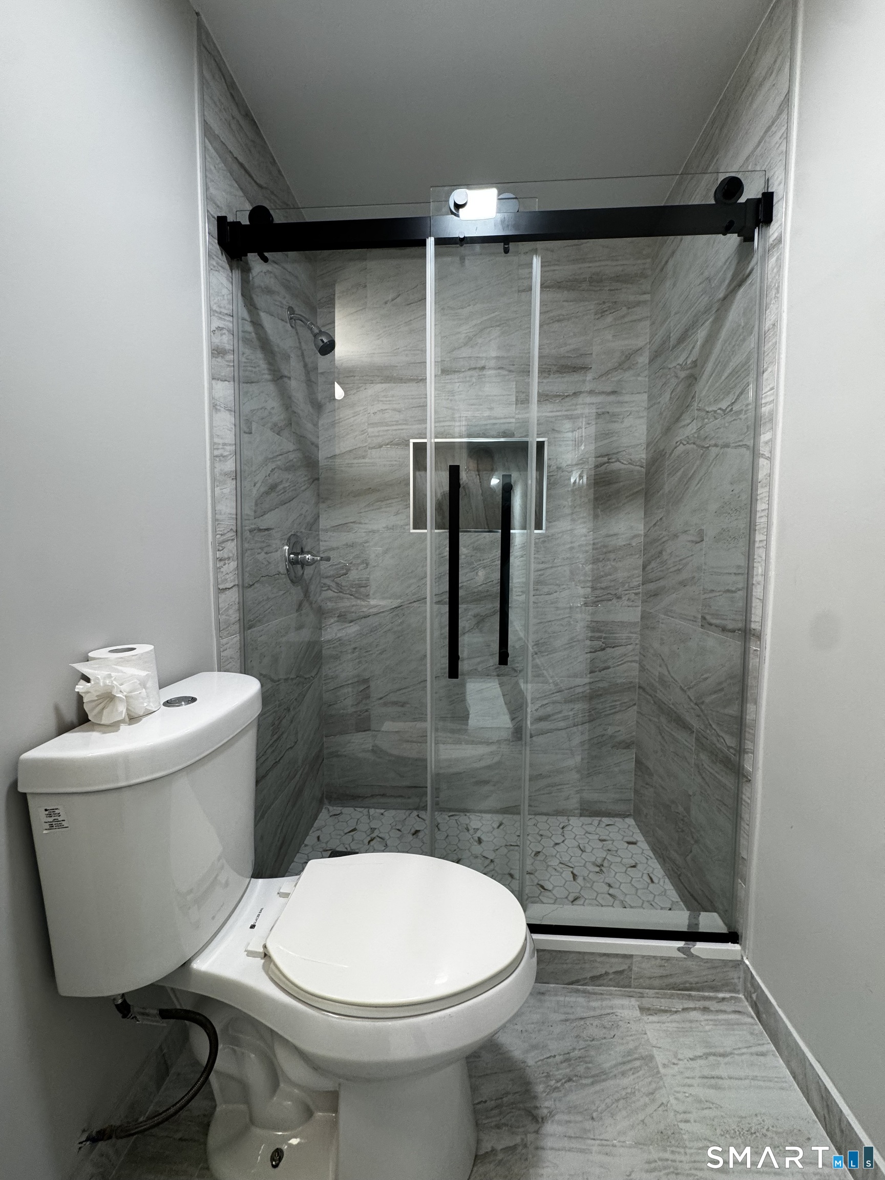45-51 Cowles Street, Unit 45 Bridgeport, CT 06607 - Photo 11 of 33 a bathroom with a sink toilet and shower
