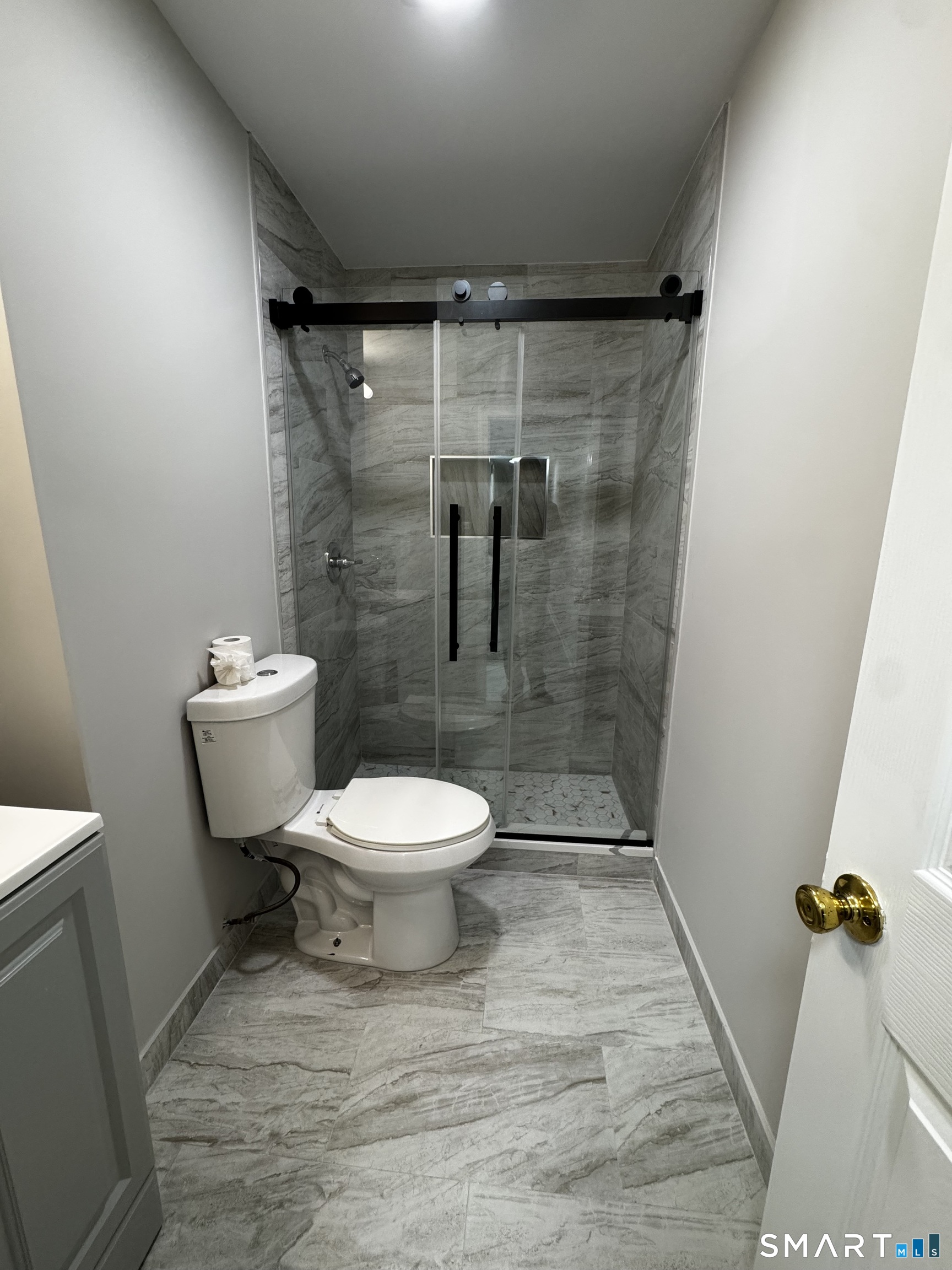 45-51 Cowles Street, Unit 45 Bridgeport, CT 06607 - Photo 13 of 33 a bathroom with a toilet and a shower