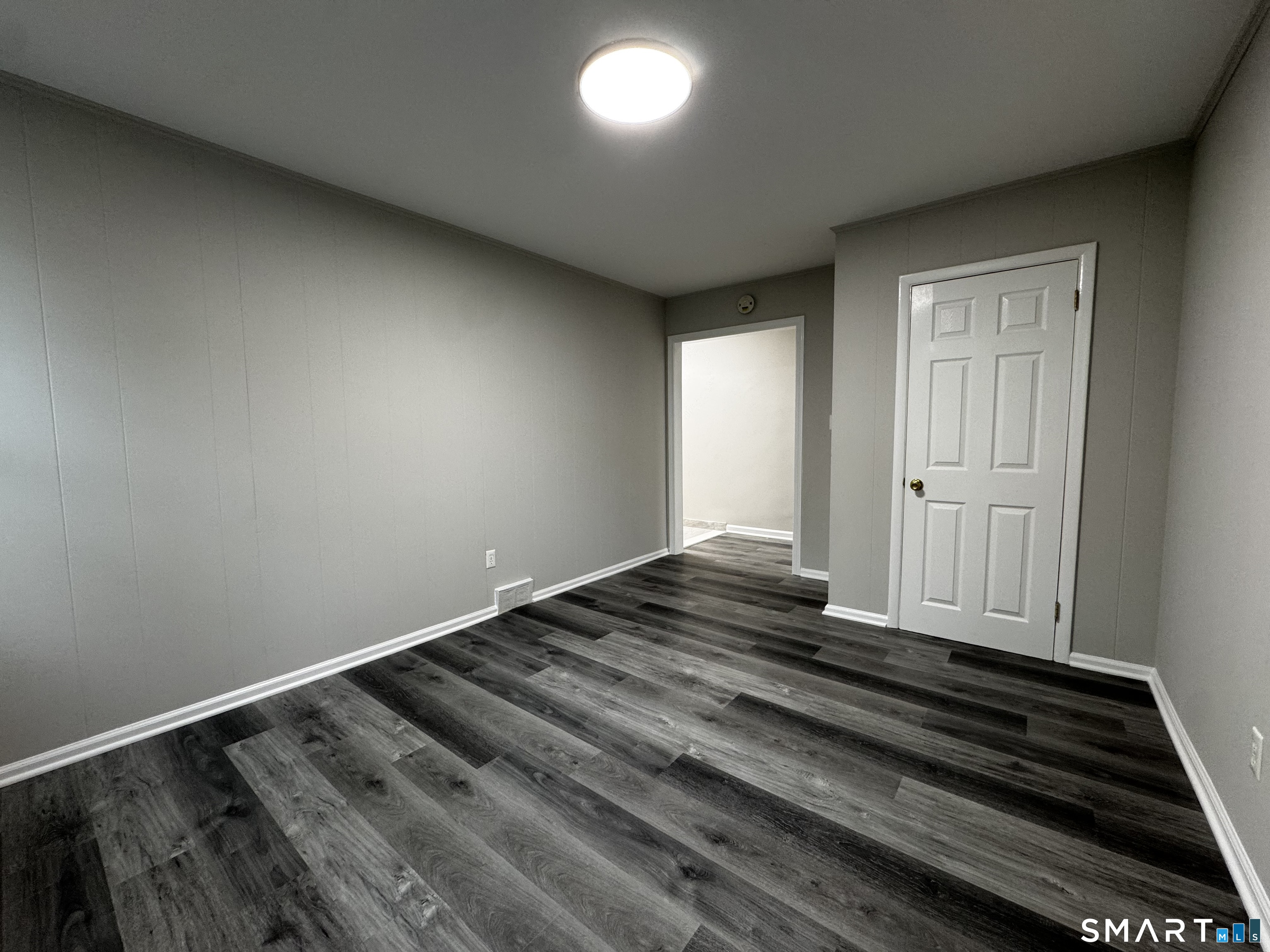 45-51 Cowles Street, Unit 45 Bridgeport, CT 06607 - Photo 16 of 33 a view of a room with wooden floor and staircase