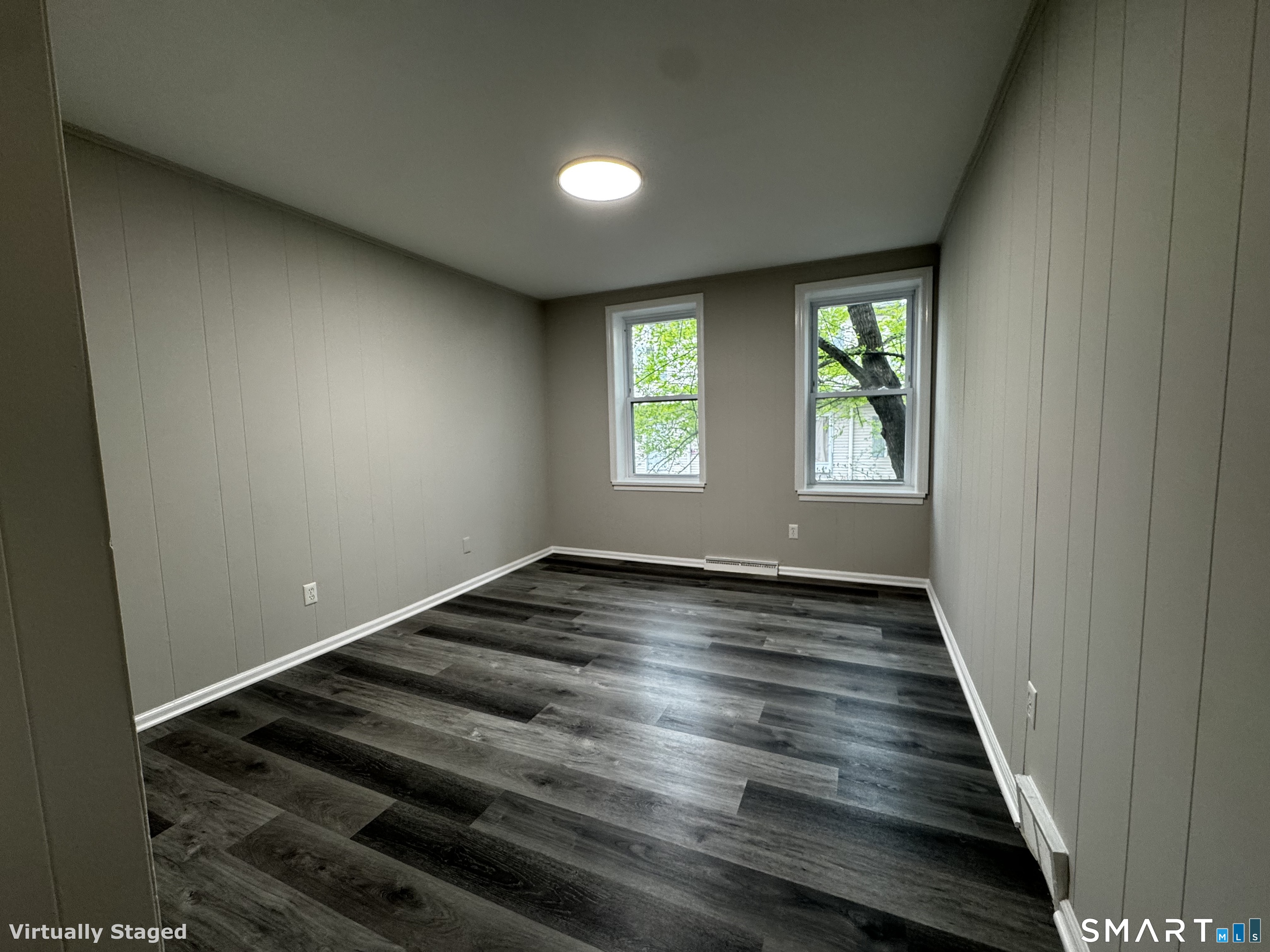 45-51 Cowles Street, Unit 45 Bridgeport, CT 06607 - Photo 17 of 33 a view of an empty room with wooden floor and a window