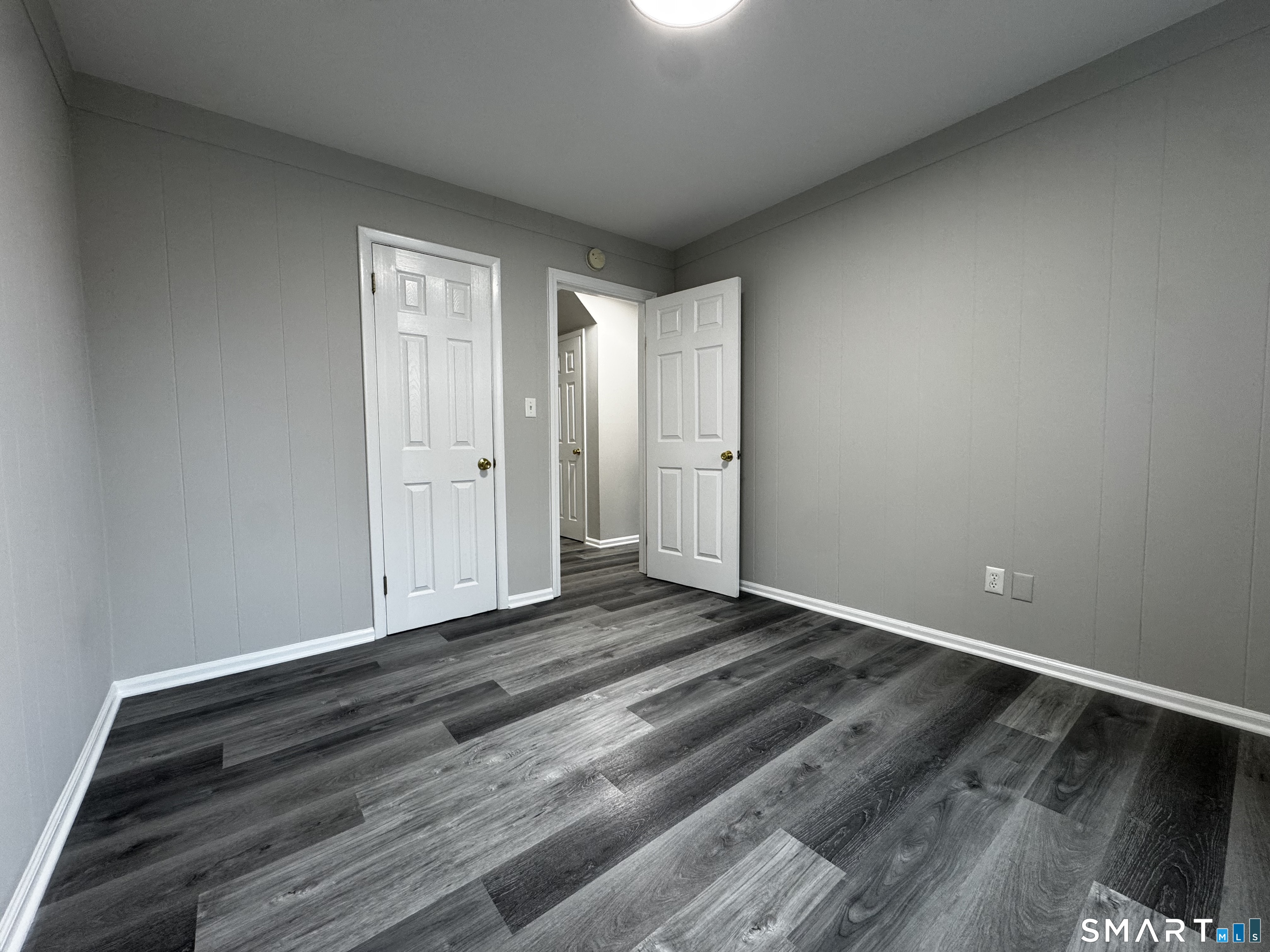 45-51 Cowles Street, Unit 45 Bridgeport, CT 06607 - Photo 21 of 33 a view of an empty room and wooden floor