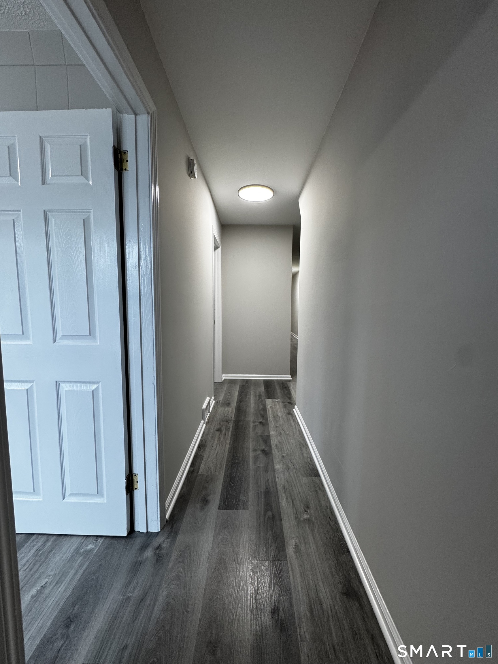 45-51 Cowles Street, Unit 45 Bridgeport, CT 06607 - Photo 25 of 33 a view of hallway with wooden floor
