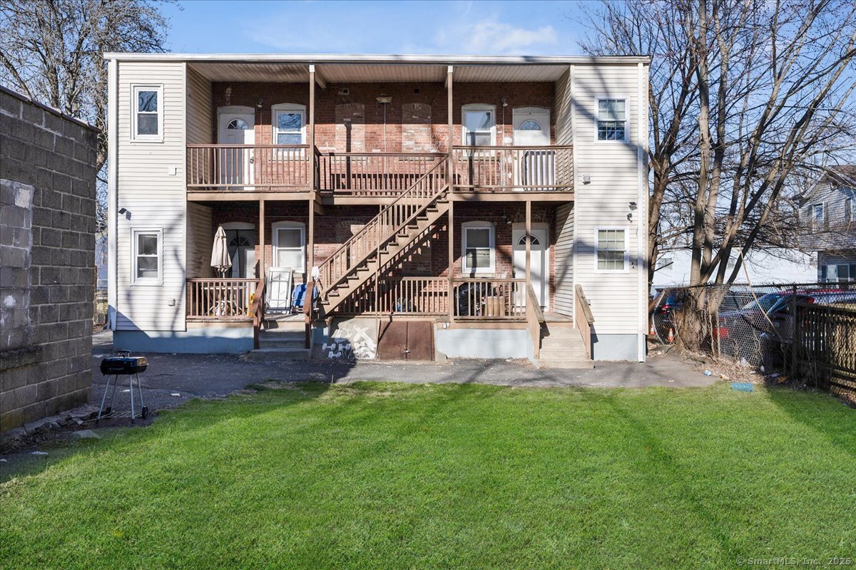 45-51 Cowles Street, Unit 45 Bridgeport, CT 06607 - Photo 32 of 33 a view of a house with a yard