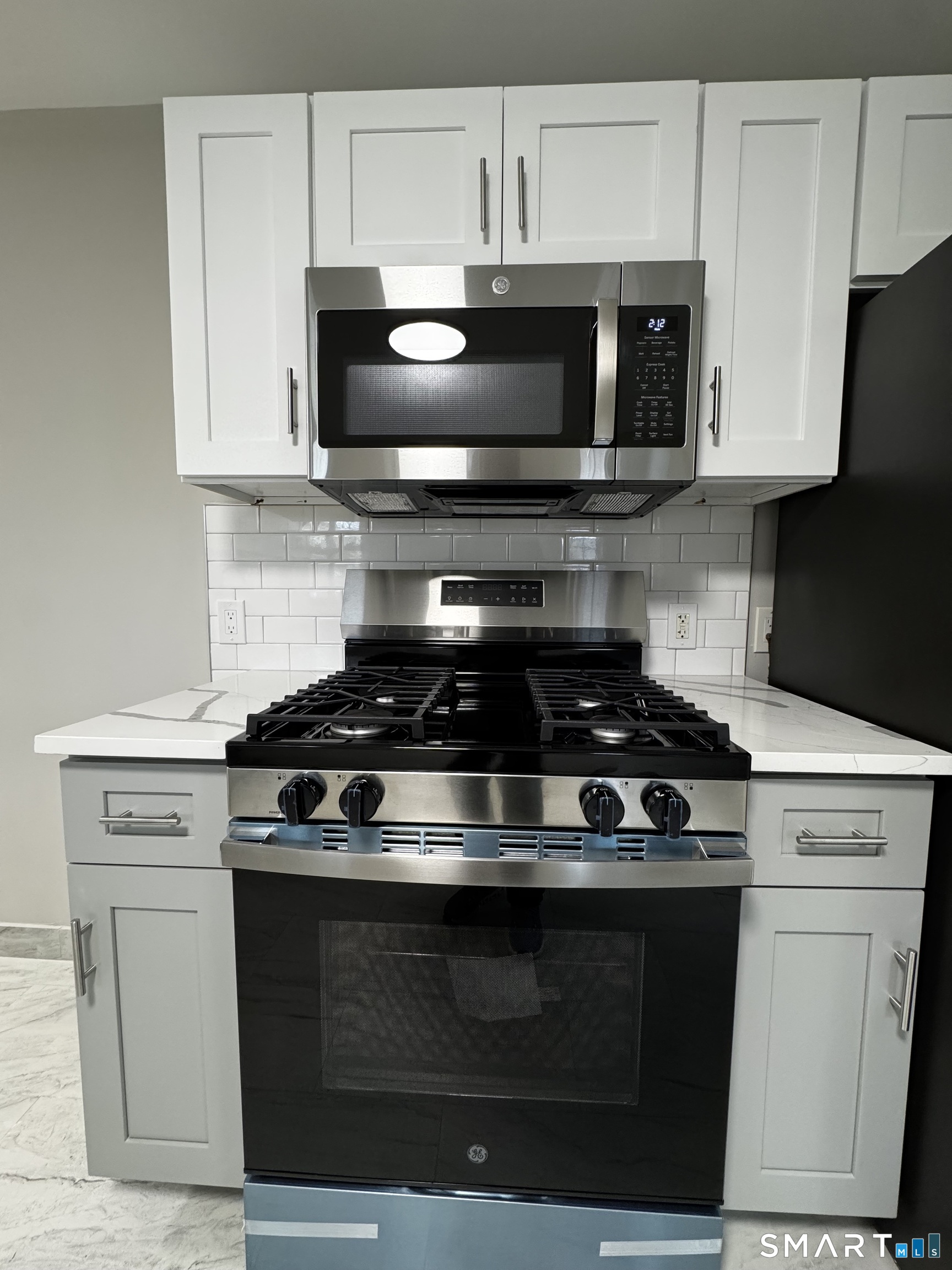 45-51 Cowles Street, Unit 45 Bridgeport, CT 06607 - Photo 5 of 33 a stove top oven sitting inside of a kitchen