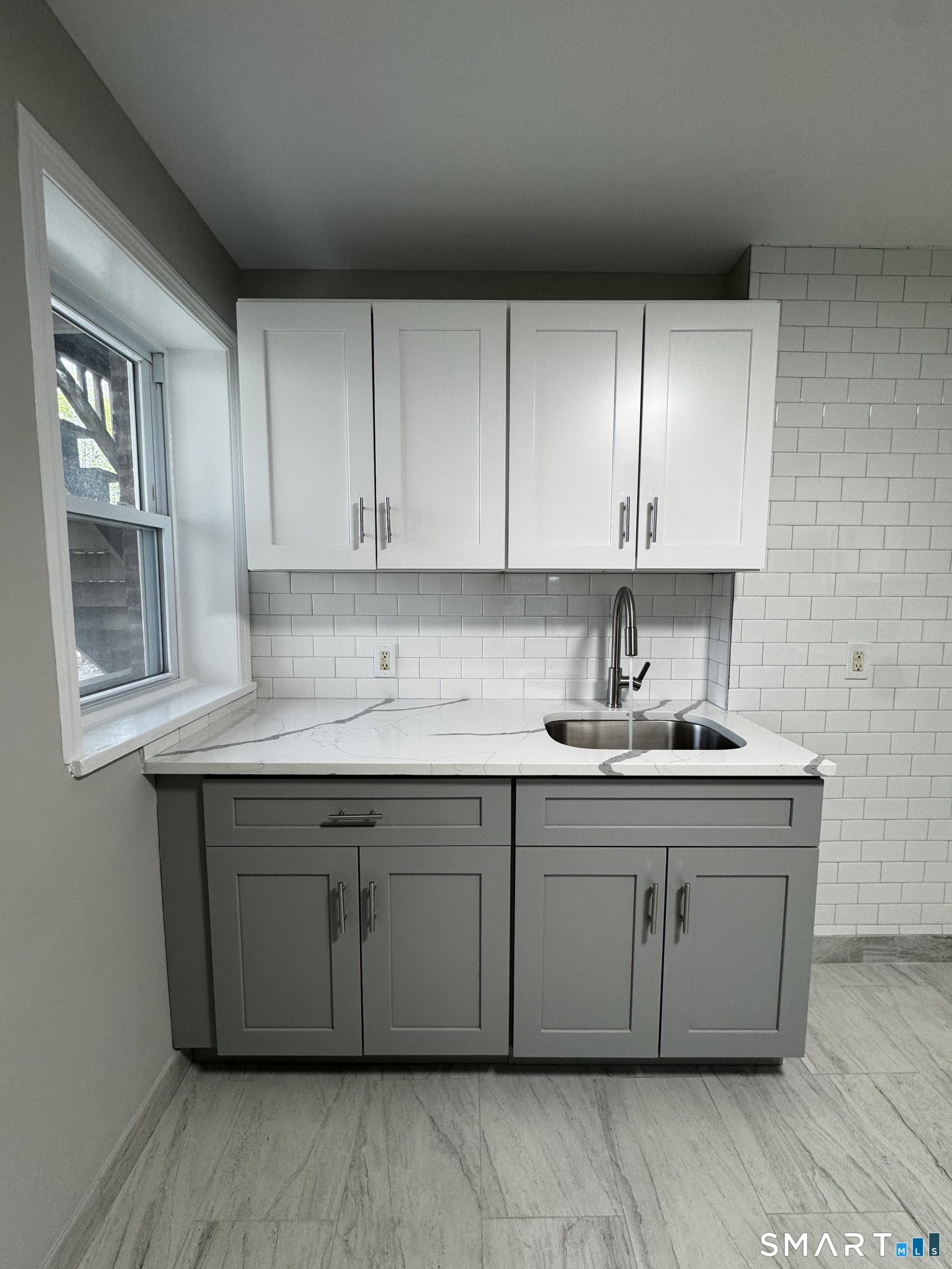 45-51 Cowles Street, Unit 45 Bridgeport, CT 06607 - Photo 6 of 33 a kitchen with stainless steel appliances granite countertop a sink stove and cabinets