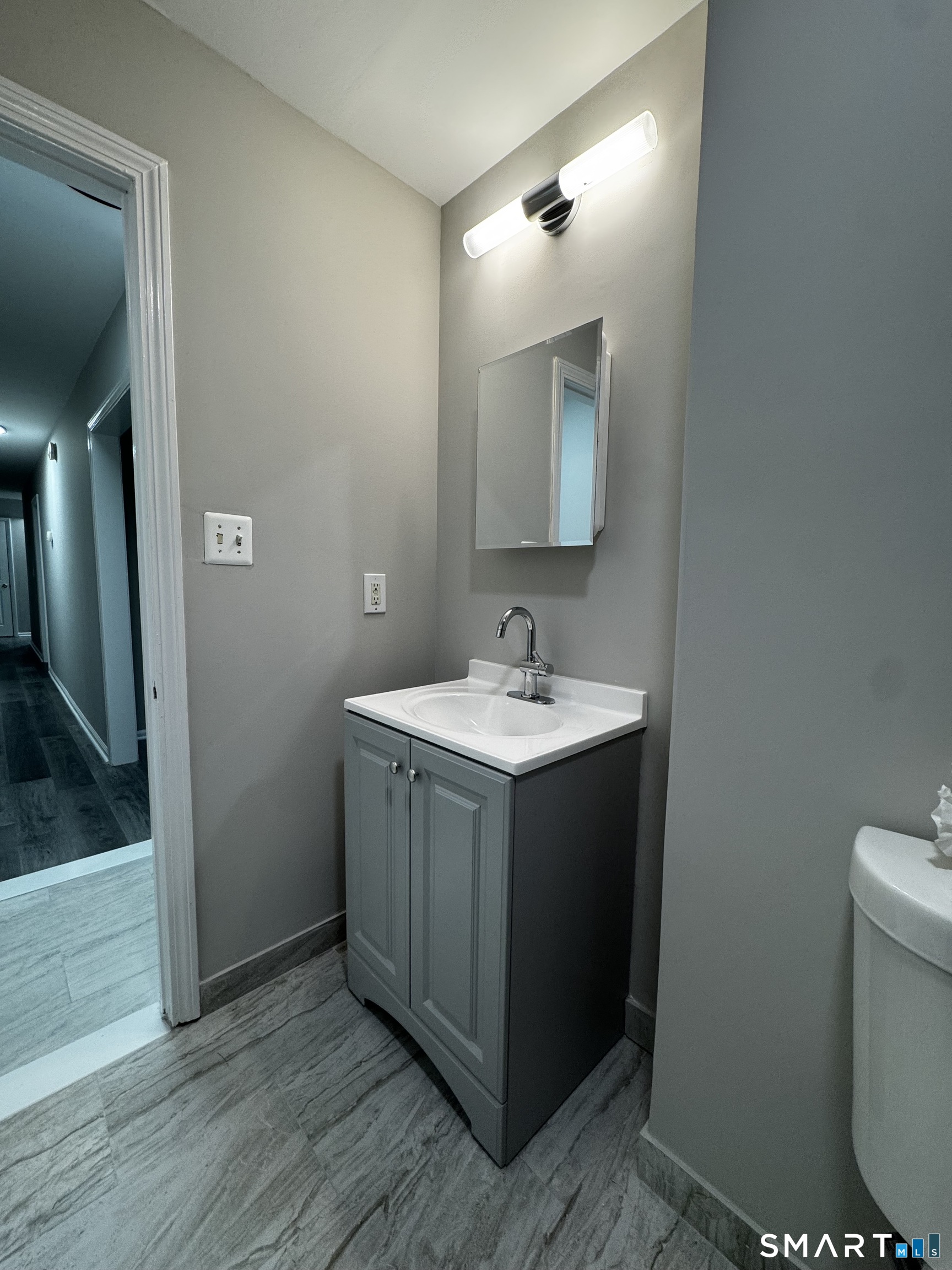 45-51 Cowles Street, Unit 45 Bridgeport, CT 06607 - Photo 10 of 33 a bathroom with a sink vanity and mirror