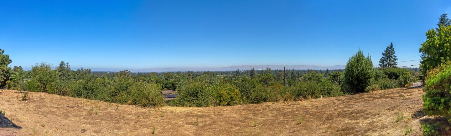 14467 De Bell Road Los Altos Hills, CA 94022 - Photo 2 of 7 a view of a road with a yard