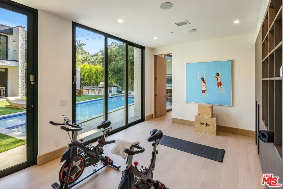17055 Rancho Street Encino, CA 91316 - Photo 49 of 73 a view of a room with gym equipment