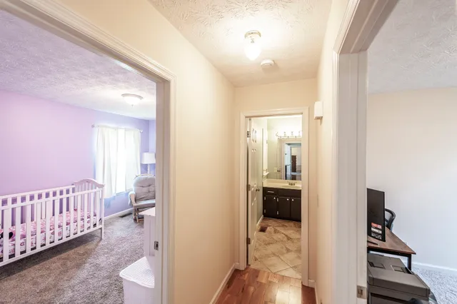 a view of a bedroom from a hallway