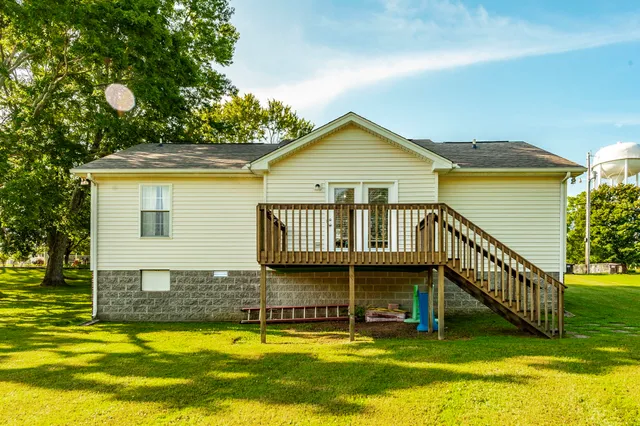 a view of a swimming pool with an outdoor space and seating area