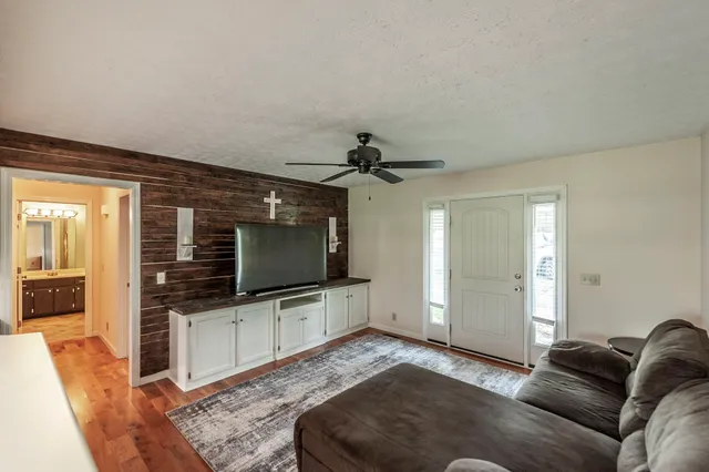 a living room with furniture and a flat screen tv